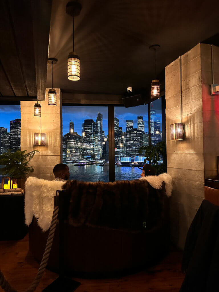 romantic-date-with-a-view-of-the-World-Trade-Center-and-Lower-Manhattan-Skyline-from-inside-Harriet's-Rooftop-in-Brooklyn