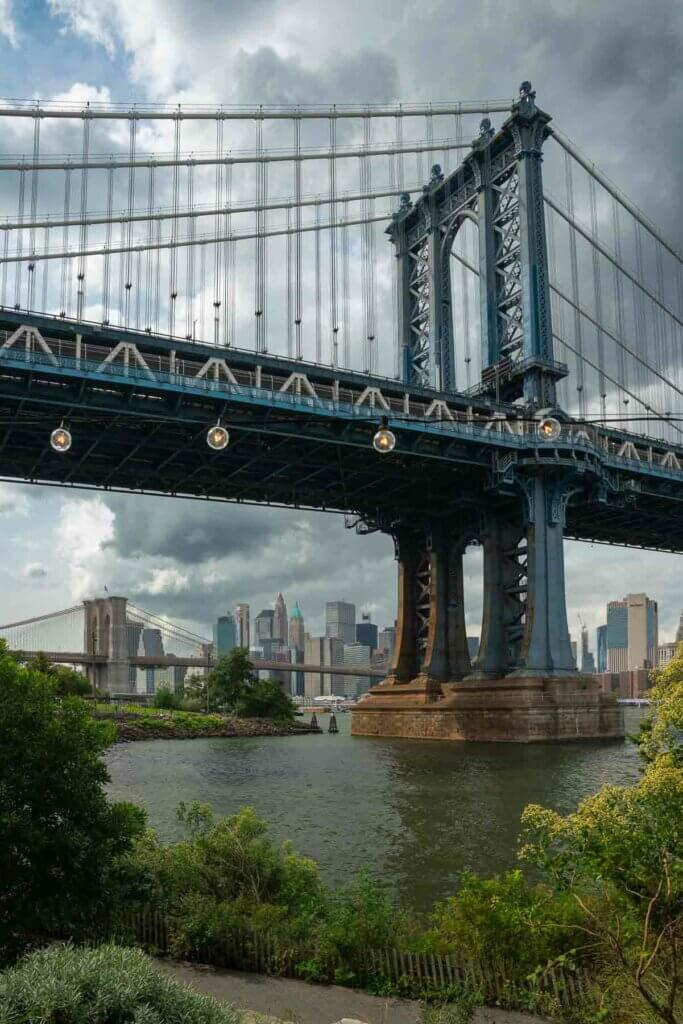 view of both Manhattan Bridge and Brooklyn Bridge from Brooklyn Bridge Park in DUMBO