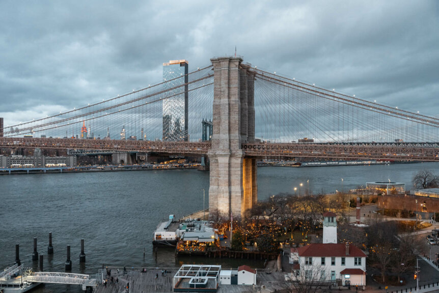winter view of Brooklyn Bridge at dusk from Harriets Rooftop Bar in Brooklyn
