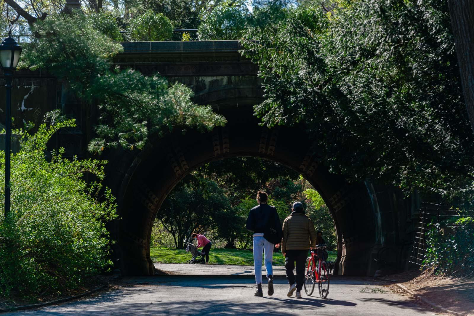 Family walking to cleft ridge arch in prospect park