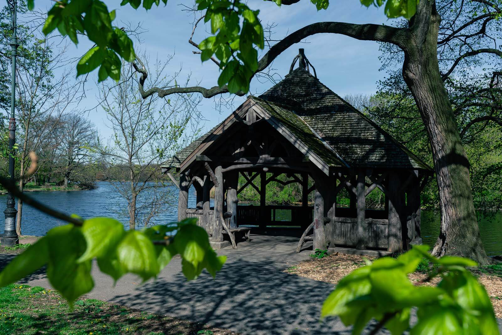 cool wooden shelter in prospect park on lake