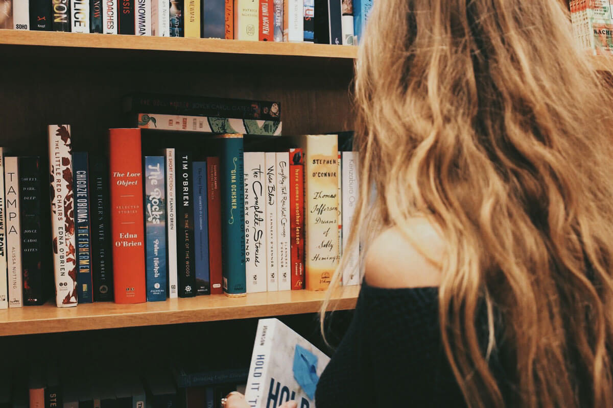 reading-a-book-at-Greenlight-Bookstore-in-Fort-Greene-by-Katie-Hinkle