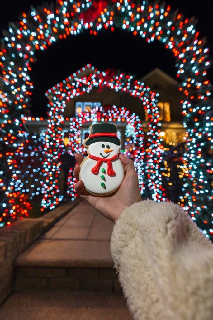 holiday snowman cookie from Tasty Pastry shoppe in Dyker Heights Brooklyn with christmas lights