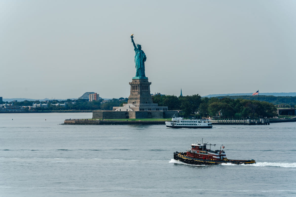 Statue-of-Liberty-with-boats-view-from-Governors-Island-in-NYC