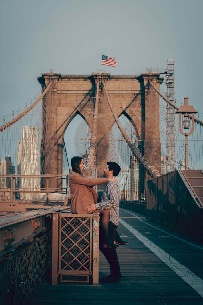 happy couple on Brooklyn Bridge photo shoot