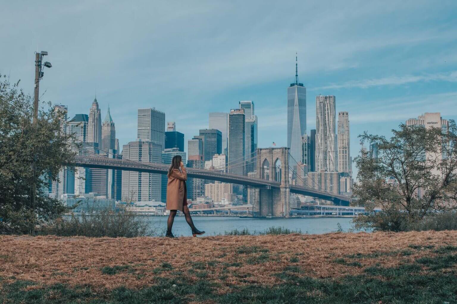 view from Brooklyn Bridge Park of Brooklyn Bridge and NYC skyline