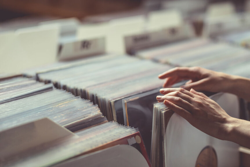 womens-hands-browsing-vinyl-records-7FH8Q2X
