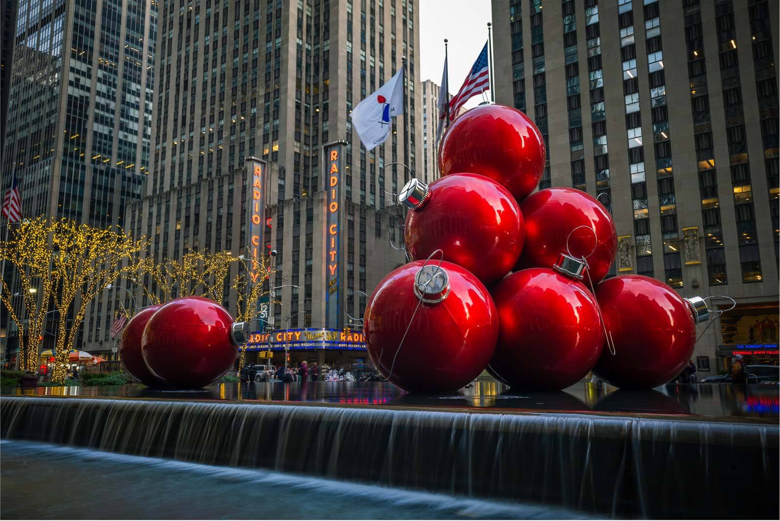 Giant Christmas ornaments on 6th avenue and radio city music hall at christmas in nyc