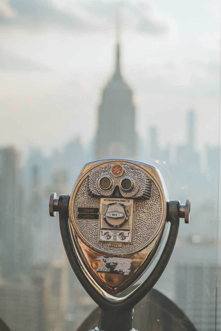 look through to see the empire state building from top of the rock in manhattan nyc