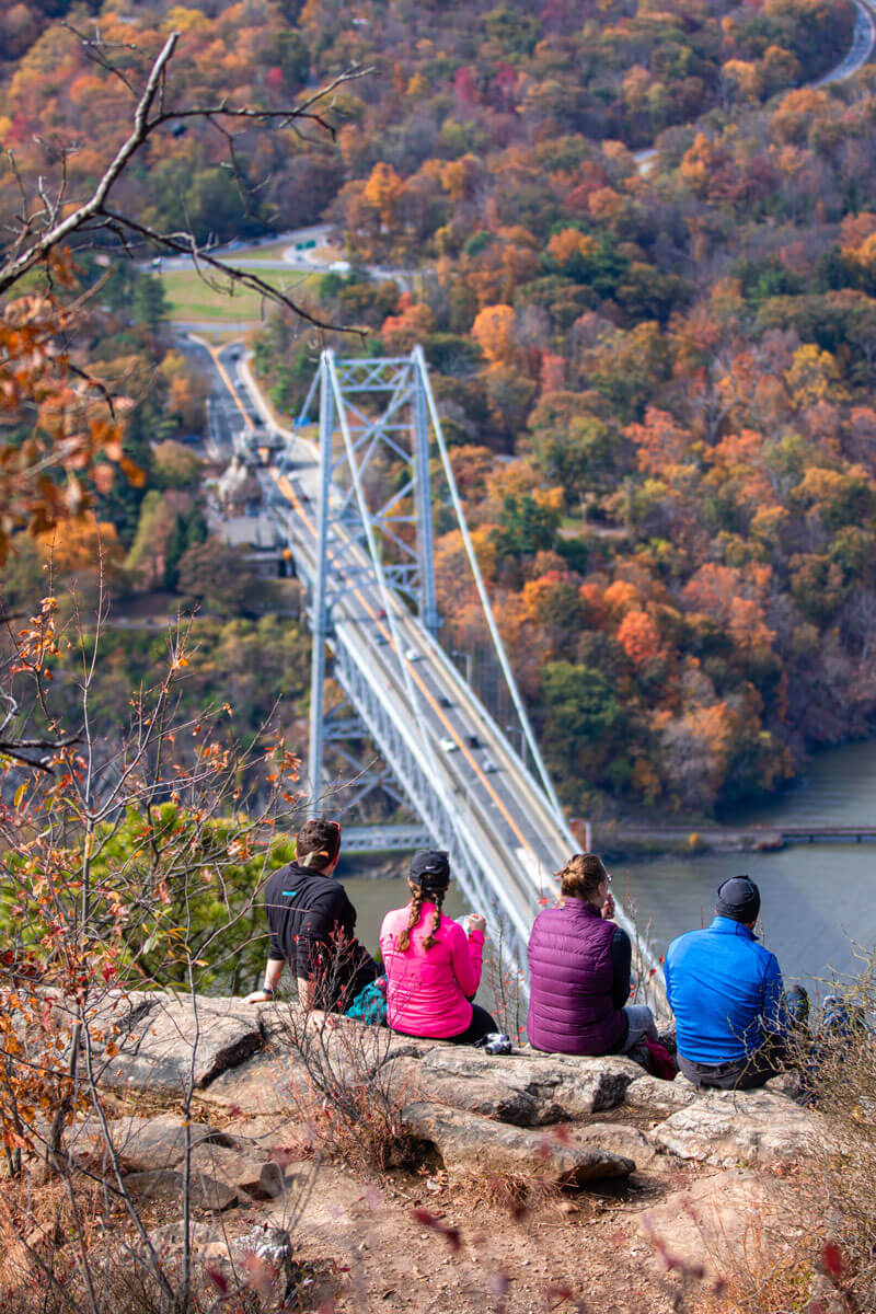 hikers-enjoying-a-break-in-the-fall-at-Anthonys-Nose-on-Bear-Mountain-hike-in-New-York