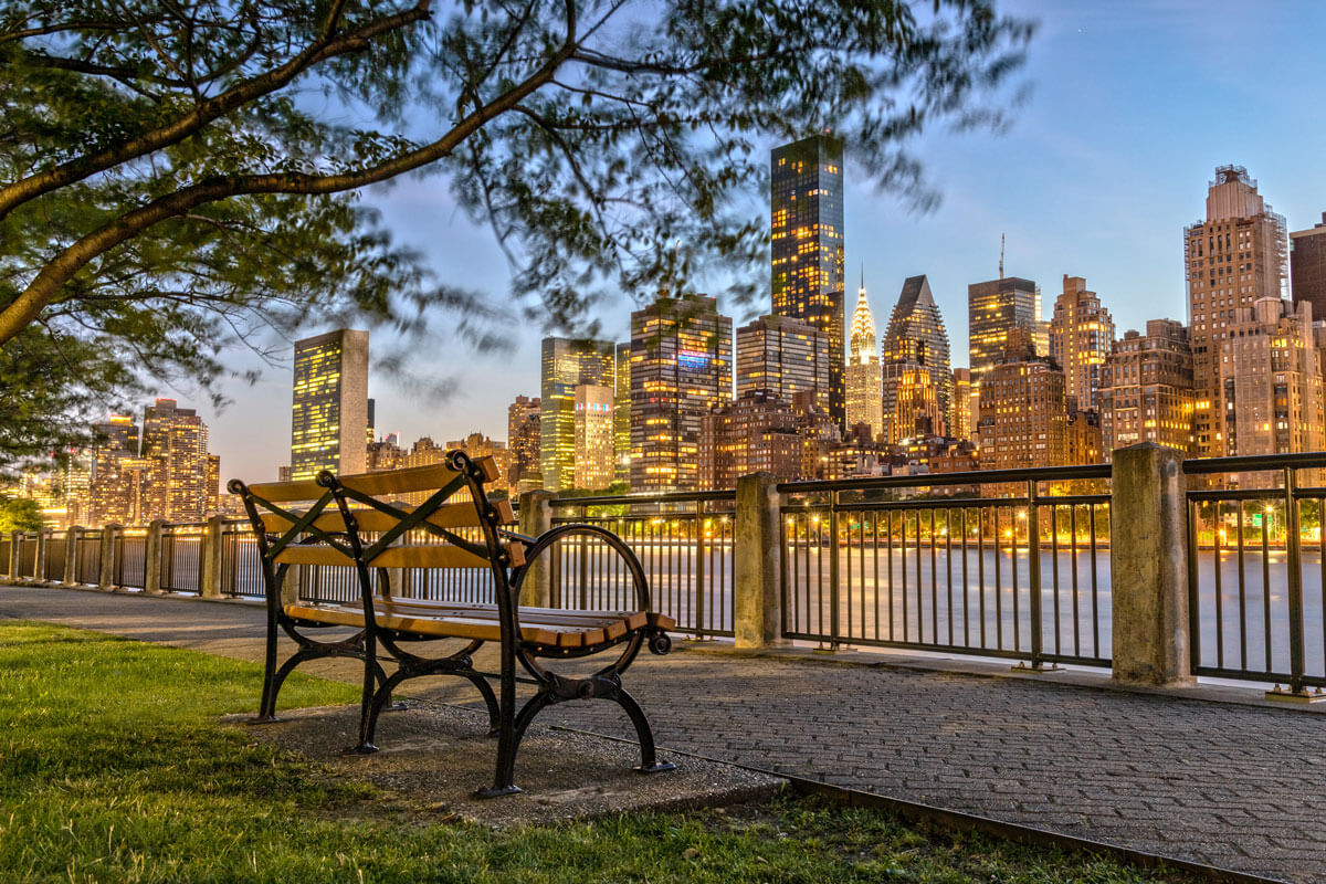 view-of-NYC-skyline-at-night-from-a-bench-on-Roosevelt-Island