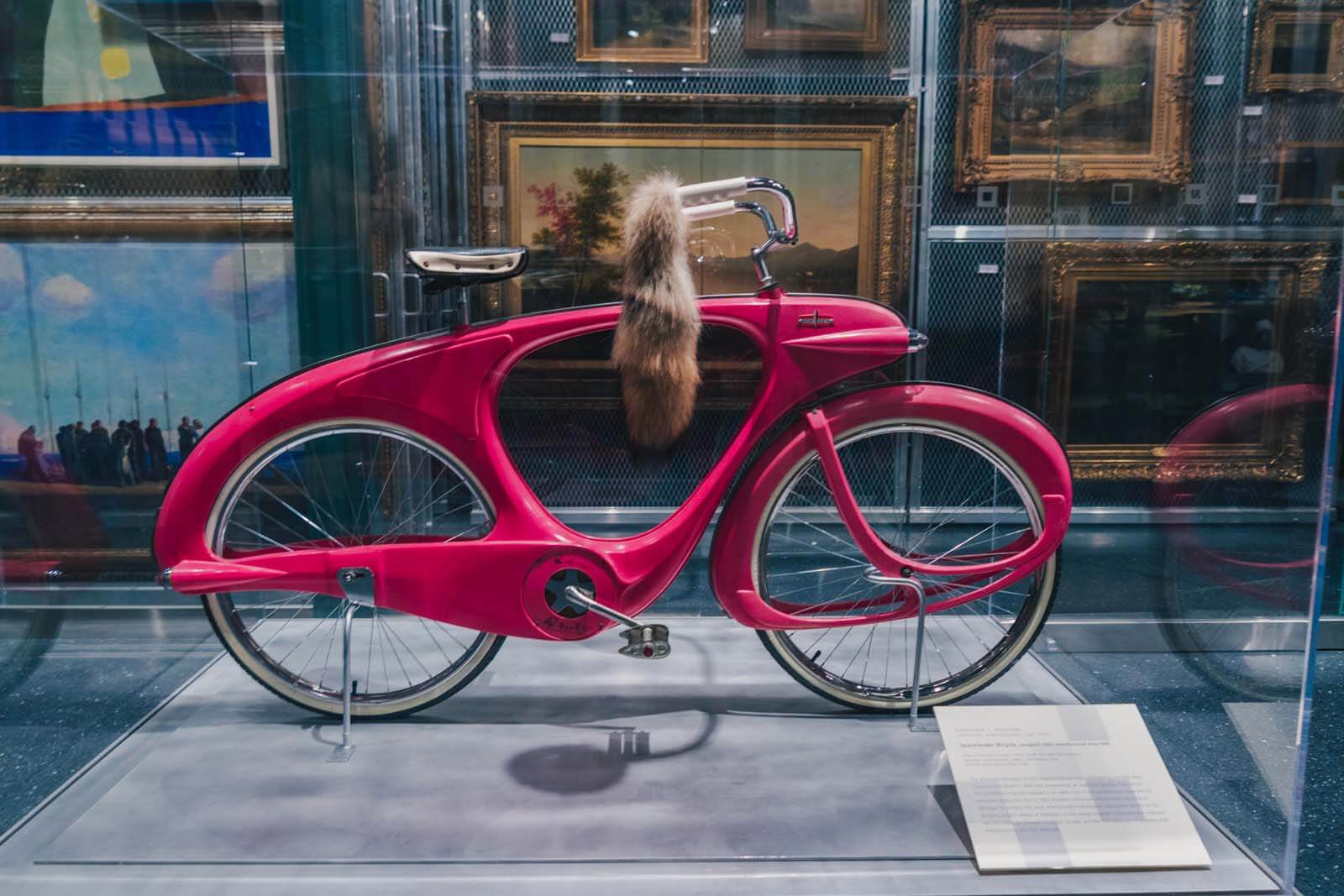 pink bicycle in visible storage in the Brooklyn Museum