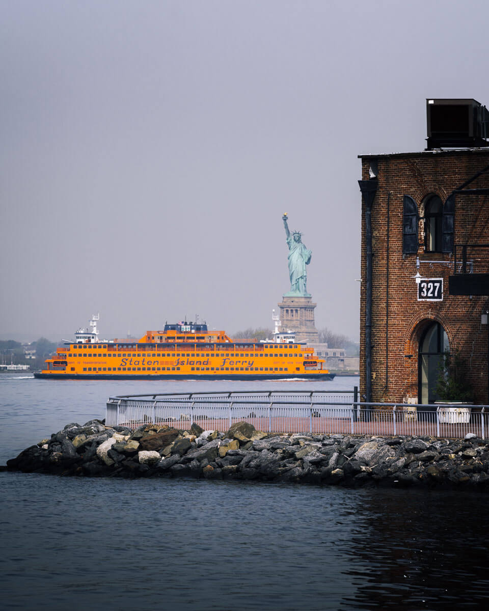 staten-island-ferry-passing-statue-of-liberty-view-from-red-hook-brooklyn