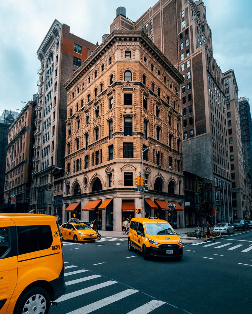 pretty Building on E 19th Street with Taxi in Manhattan NYC