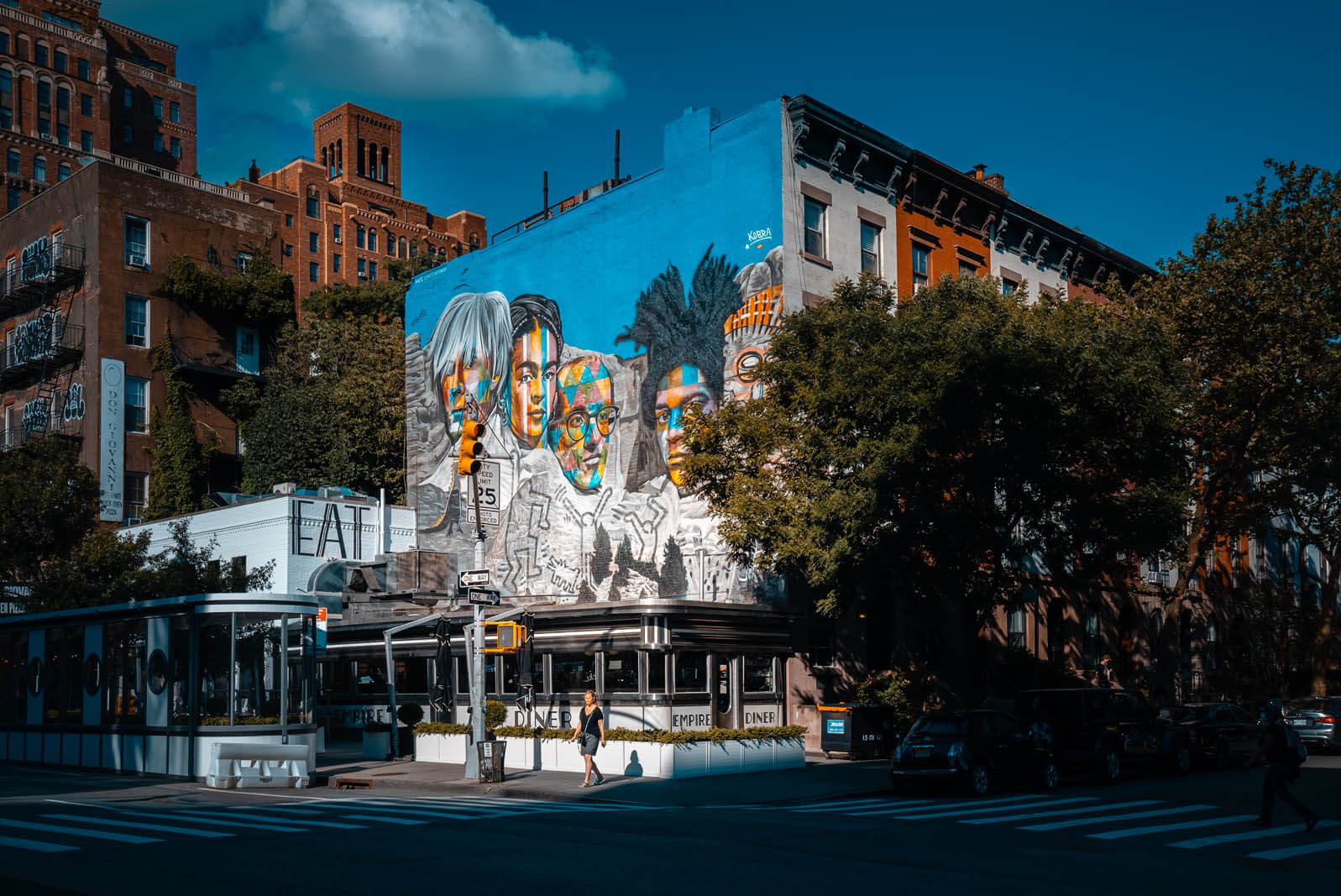 Empire Diner in NYC with a Kobra Mural above it