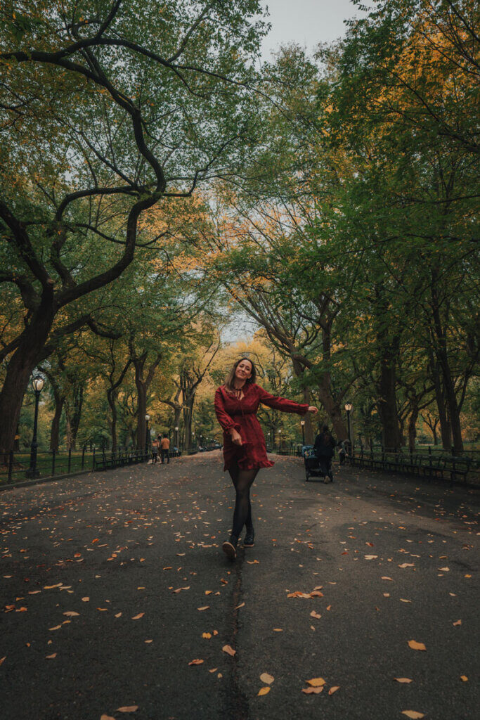 Megan-walking-through-the-Literary-Walk-in-Central-Park-in-NYC-in-the-fall