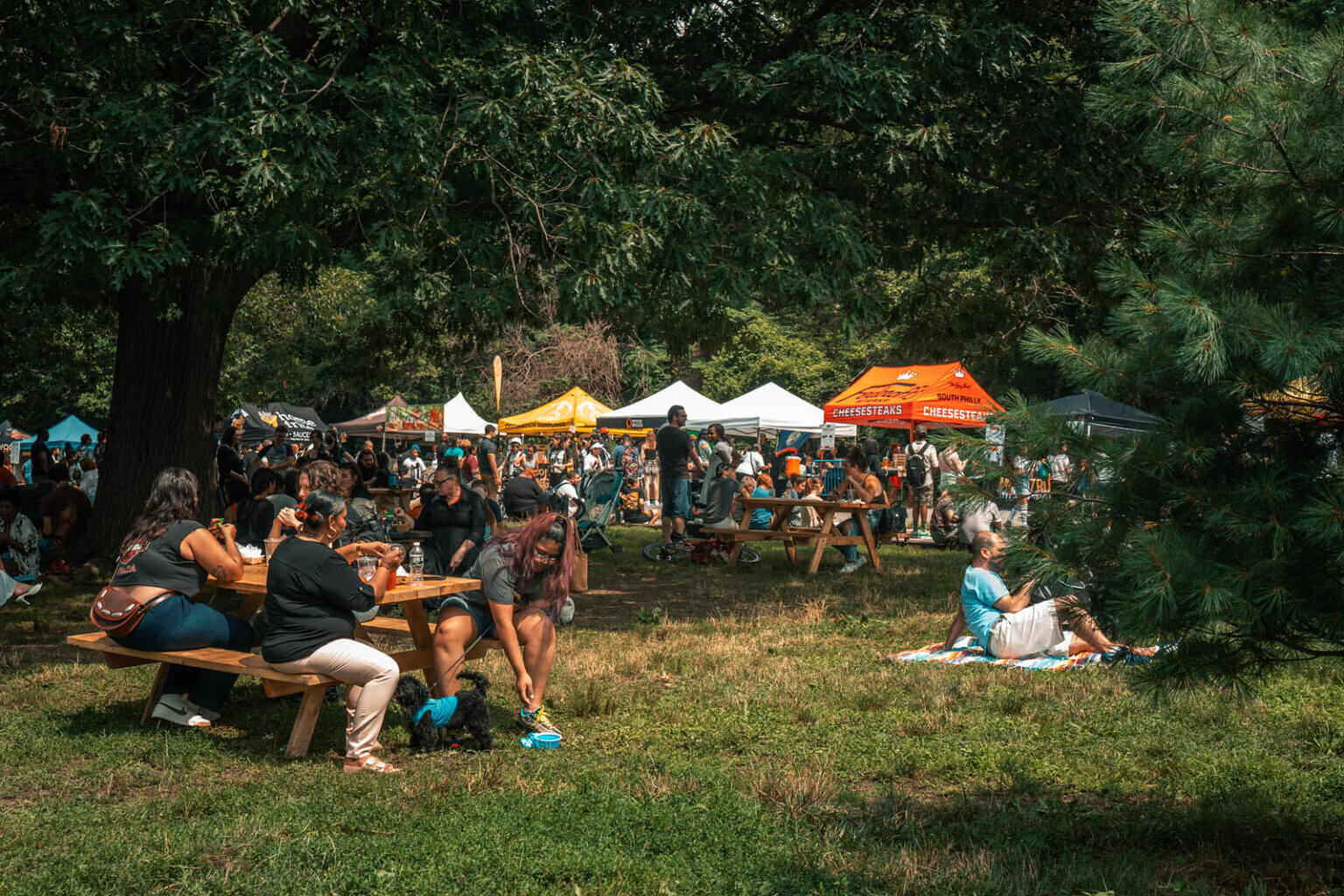 people enjoying their food from Smorgasburg in Prospect Park Brooklyn