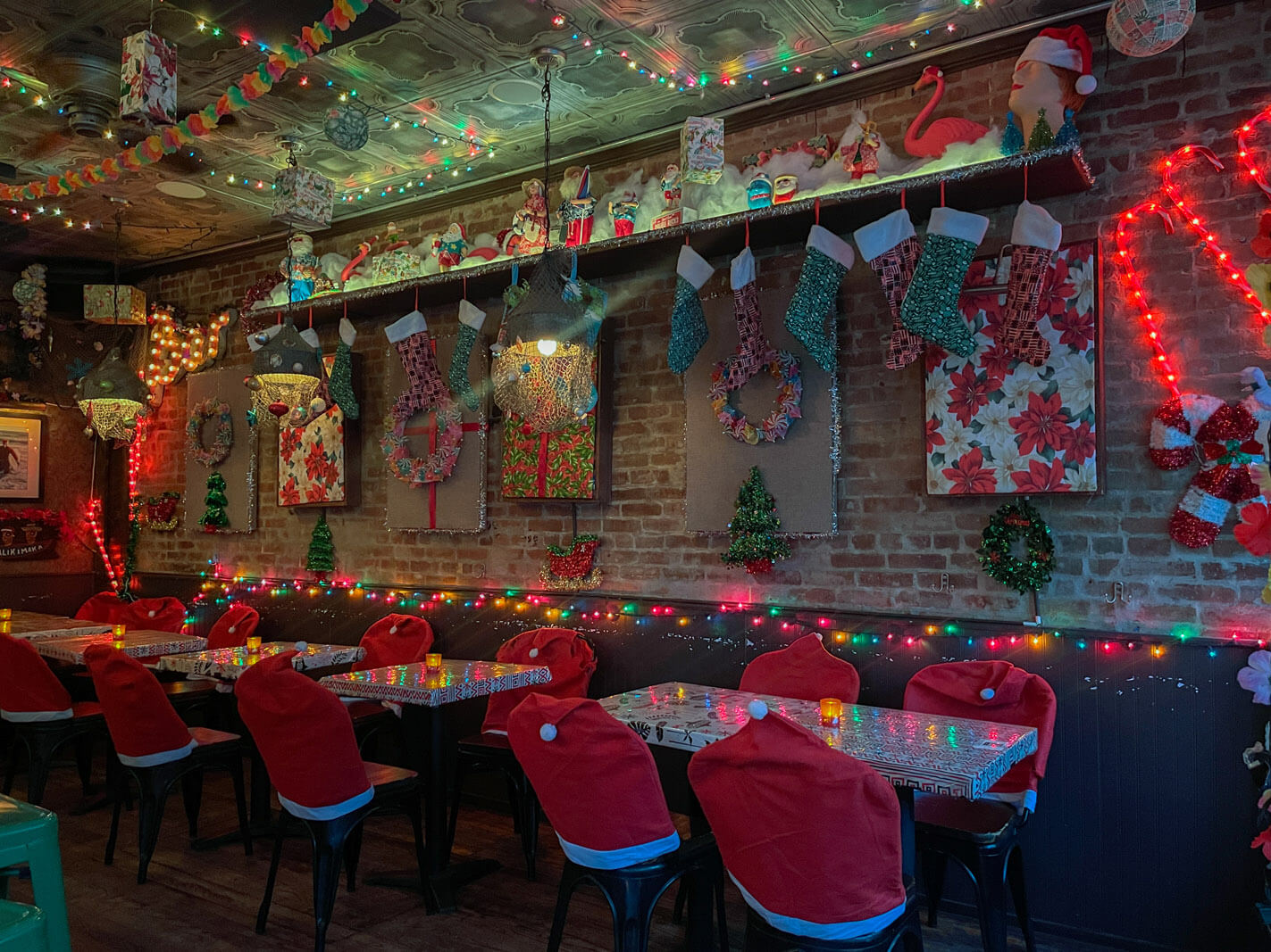 Interior of Boiler Maker Sippin Santa christmas pop up bar in NYC