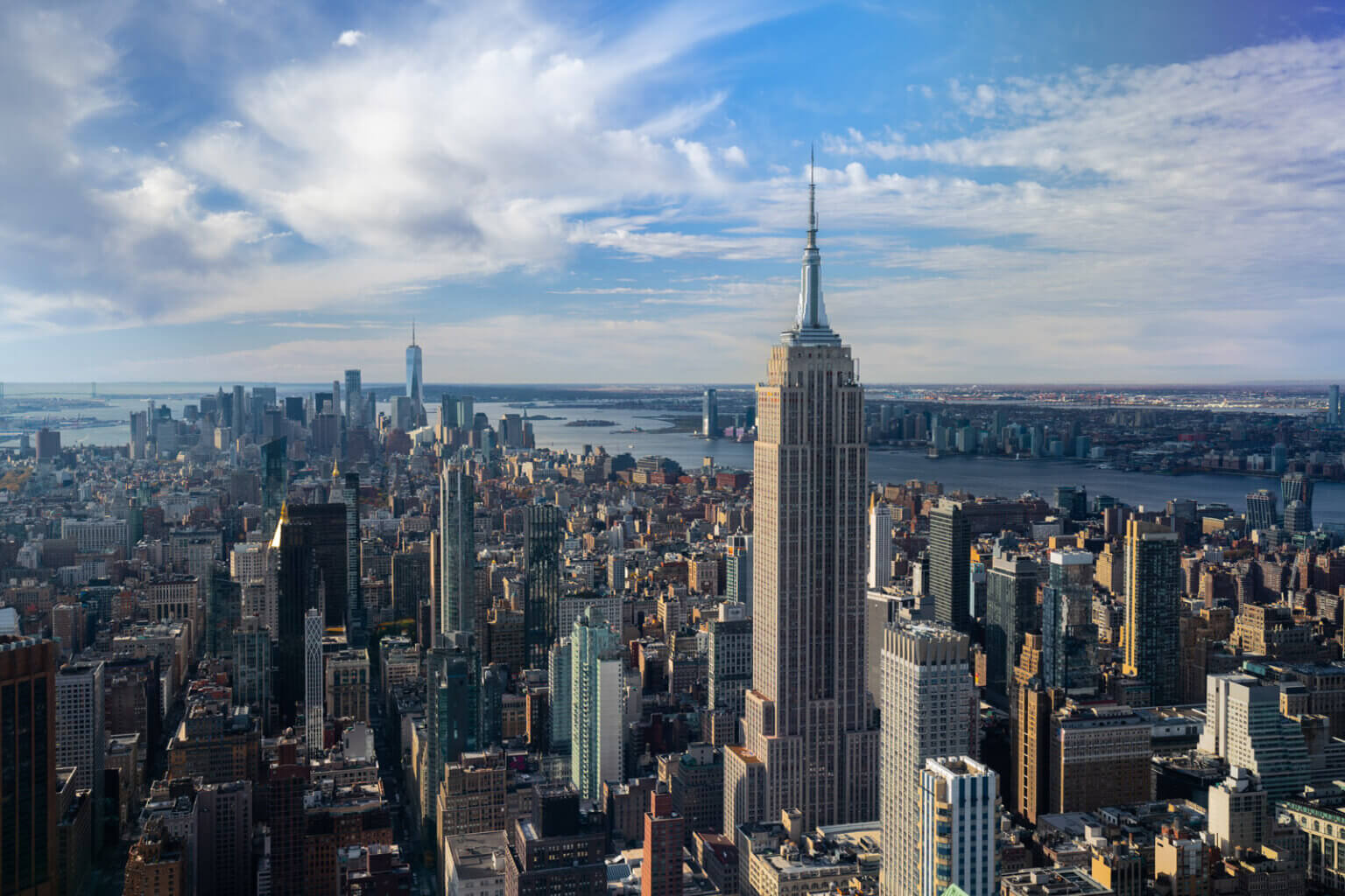 view of Empire State Building and Lower Manhattan and World Trade Center from Summit One Vanderbilt in NYC