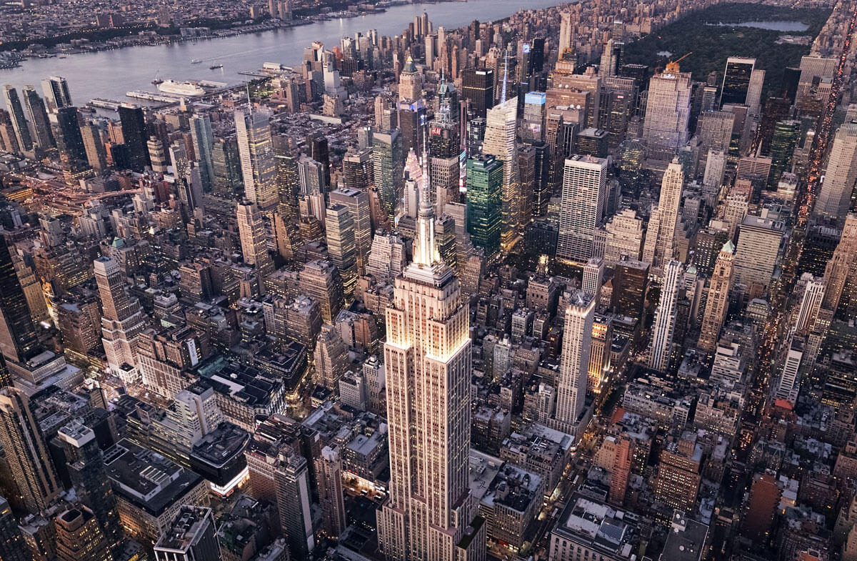 aerial-helicopter-view-over-Midtown-and-Empire-State-Building-in-NYC