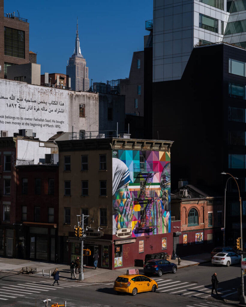 view of Kobra mural and Empire State Buidling from the High Line in Chelsea NYC