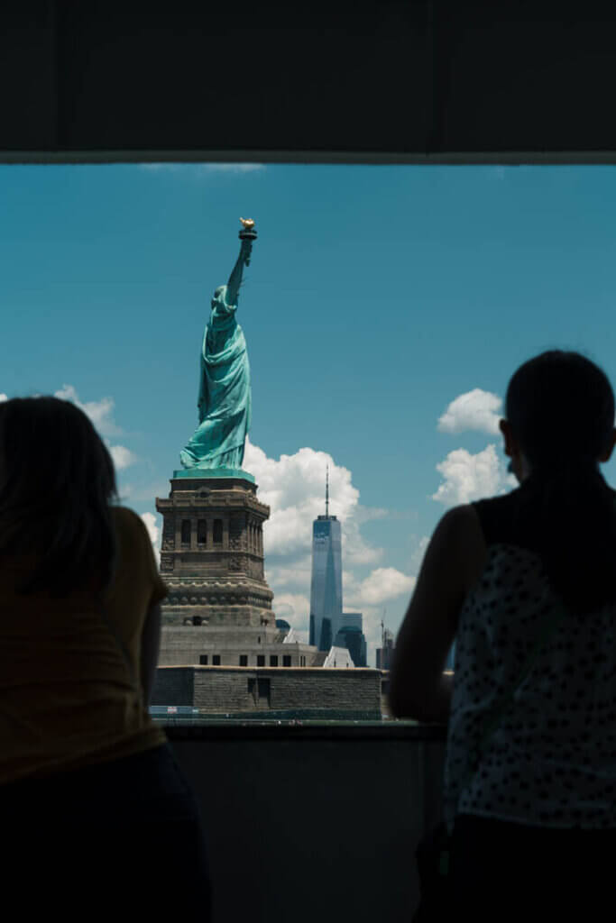 view of the statue of liberty from the ferry in NYC