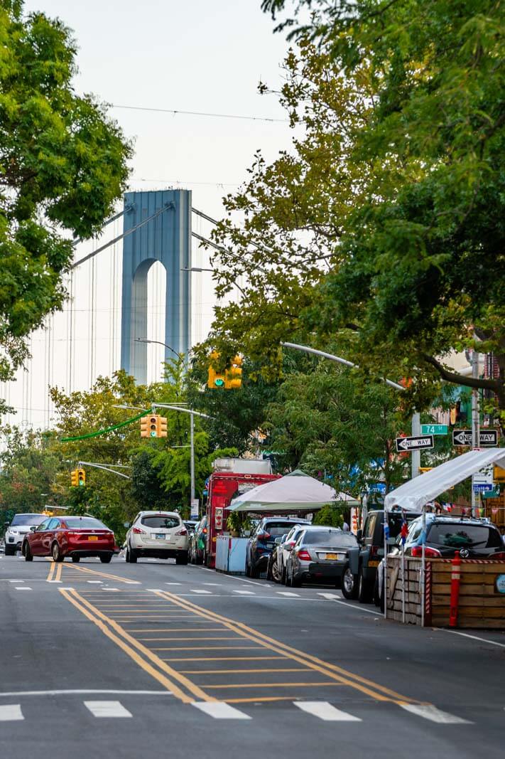 Street Scene In Bay Ridge Brooklyn With View Of The Verazzano Bridge  