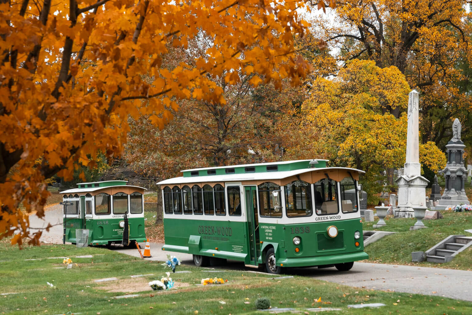 green trolleys in Green Wood Cemetery in Brooklyn in the fall