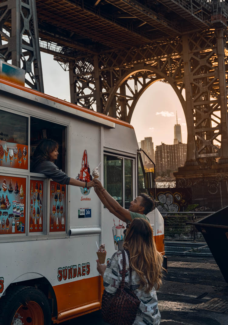 people buying ice cream from the ice cream truck at Domino Park in Brooklyn