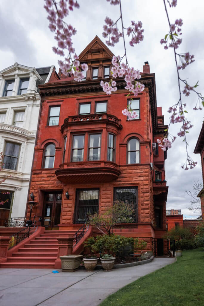 pretty Clinton Hill mansion with flowers in the spring in Brooklyn