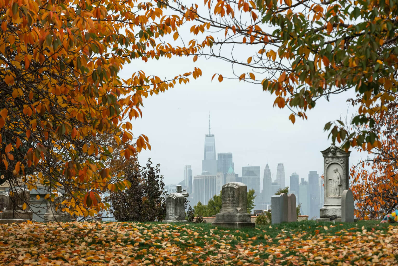 view of the world trade center in NYC from Green Wood Cemetery in Brooklyn in the fall