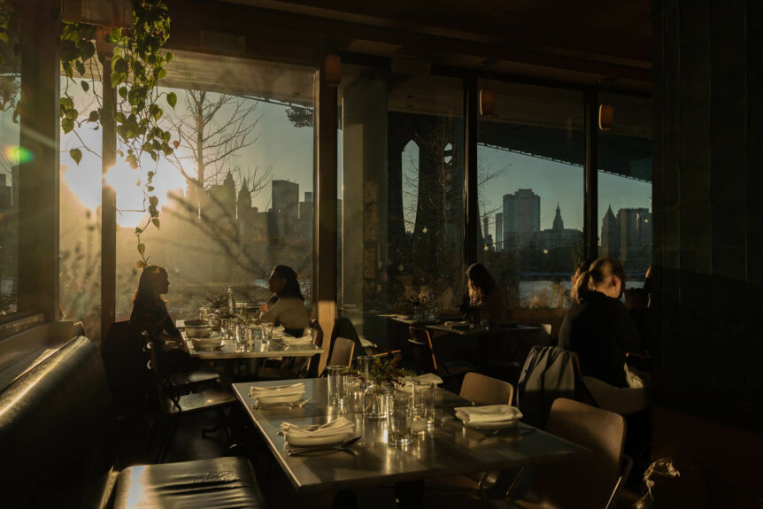 golden hour view of people dining at Celestine in Dumbo Brooklyn
