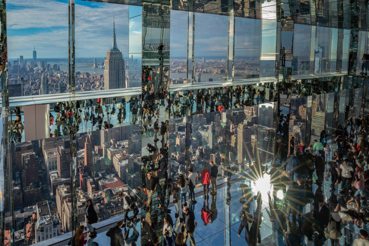 inside Summit One Vanderbilt observation deck and the reflections with the Empire State Building in Midtown NYC