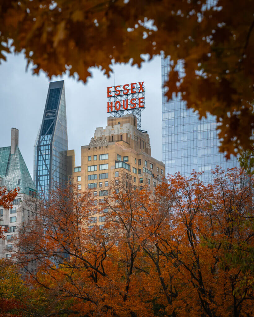 Essex House hotel sign seen from Central Park in the fall in NYC